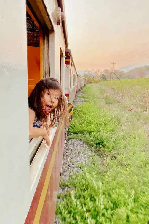 Riding the train in Thailand with kids